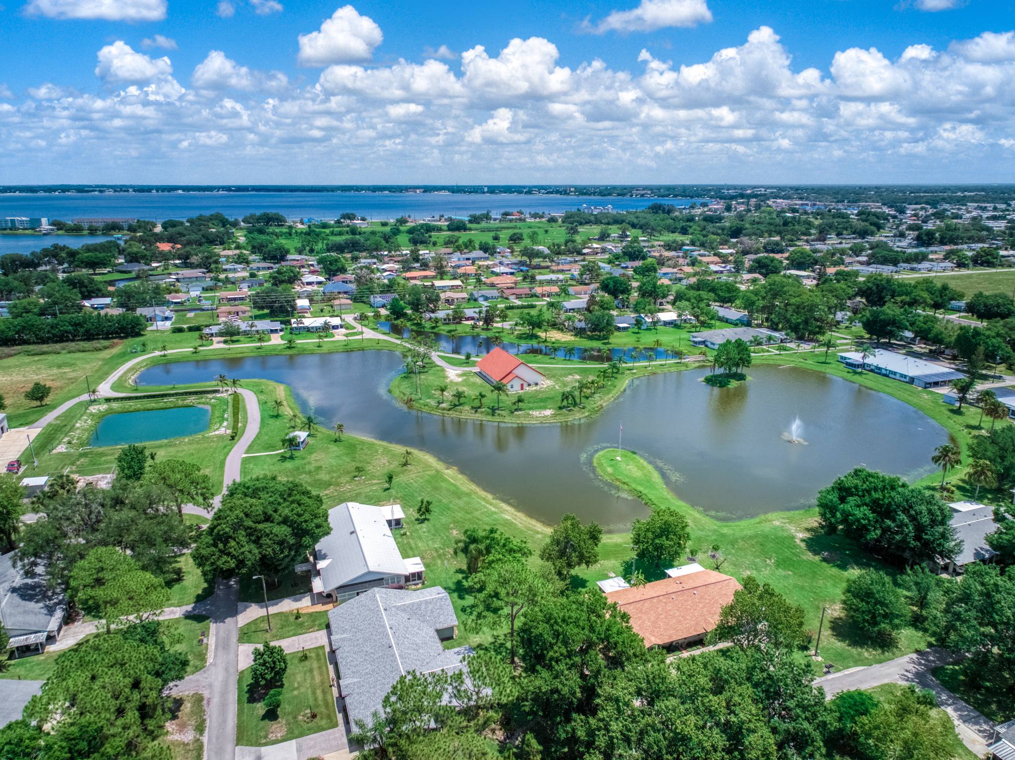 The whole Village from above: homes, the lake, the chapel, and Lake Jackson in the distance