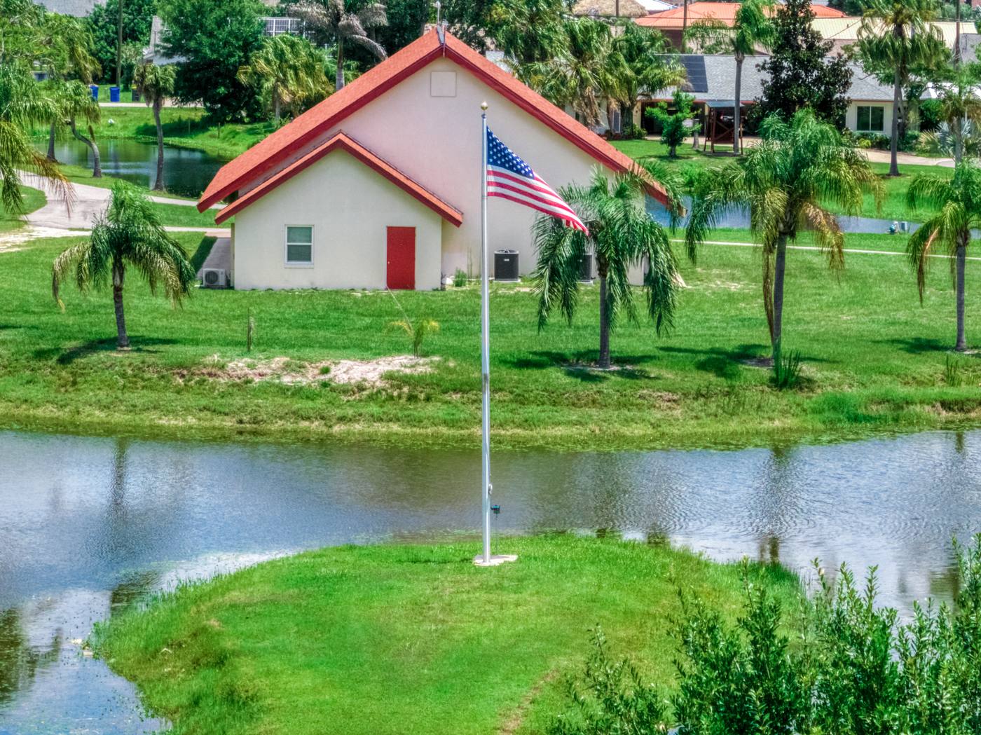 The chapel seen across the water with the flag