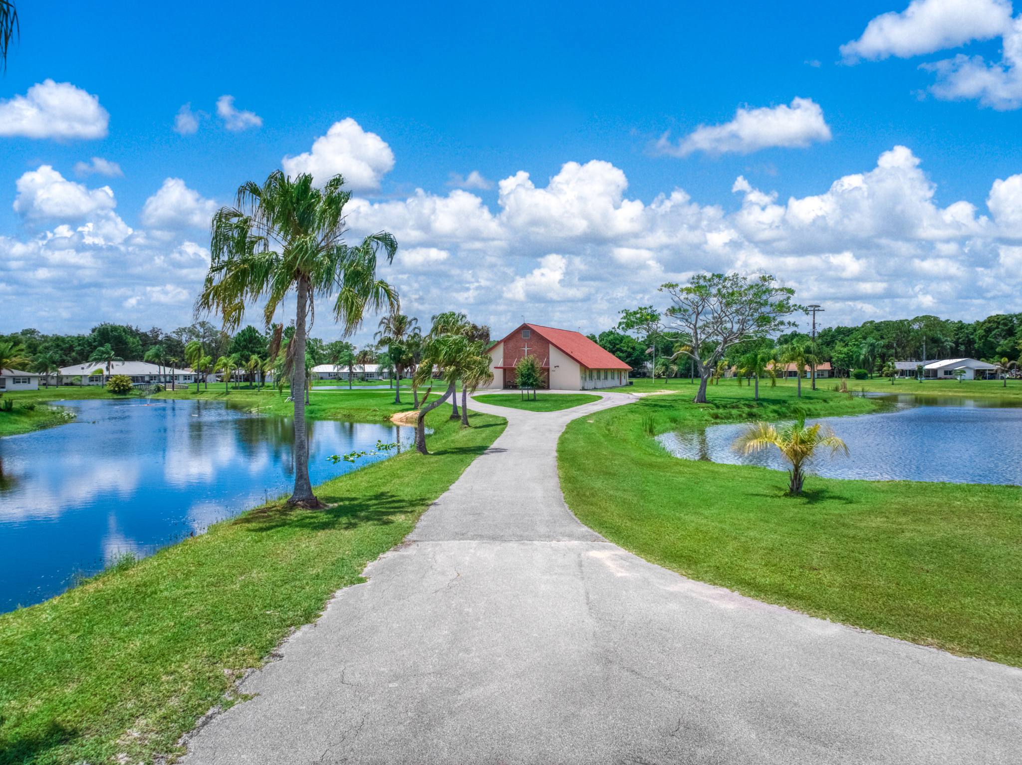 A path between two arms of the lake leading to the chapel